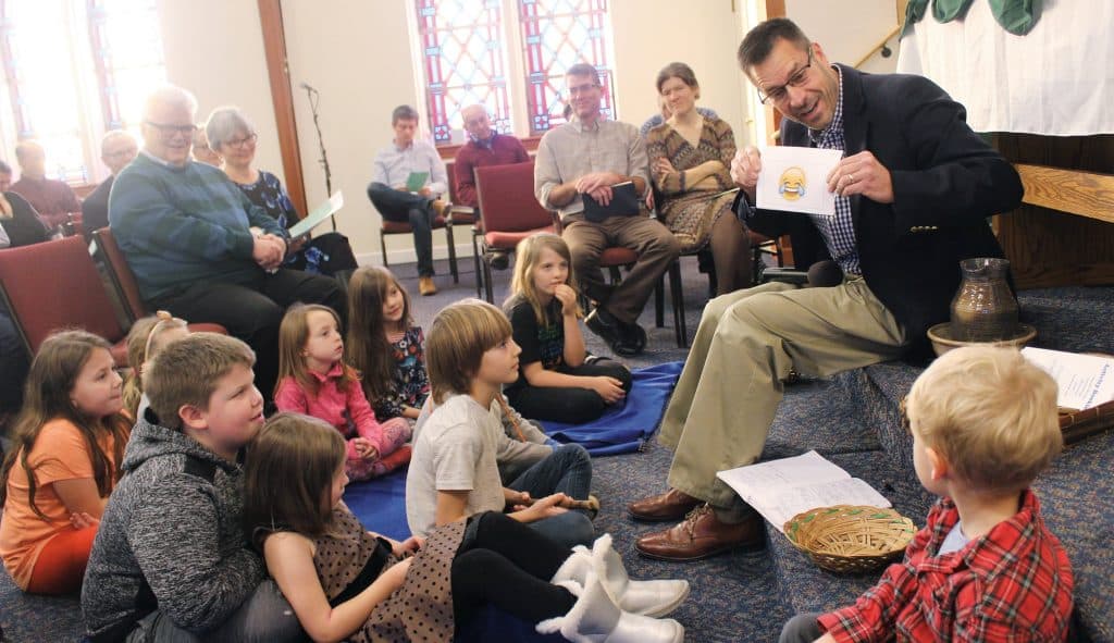Paul Leaman, head of school, during story time at Community Mennonite Church in January.